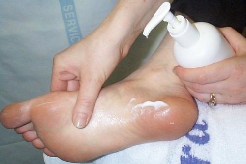 Appyling Creme to Foot for relief